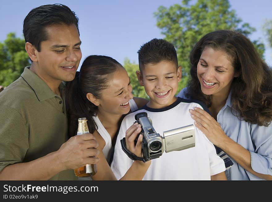 Boy looking at camcorder