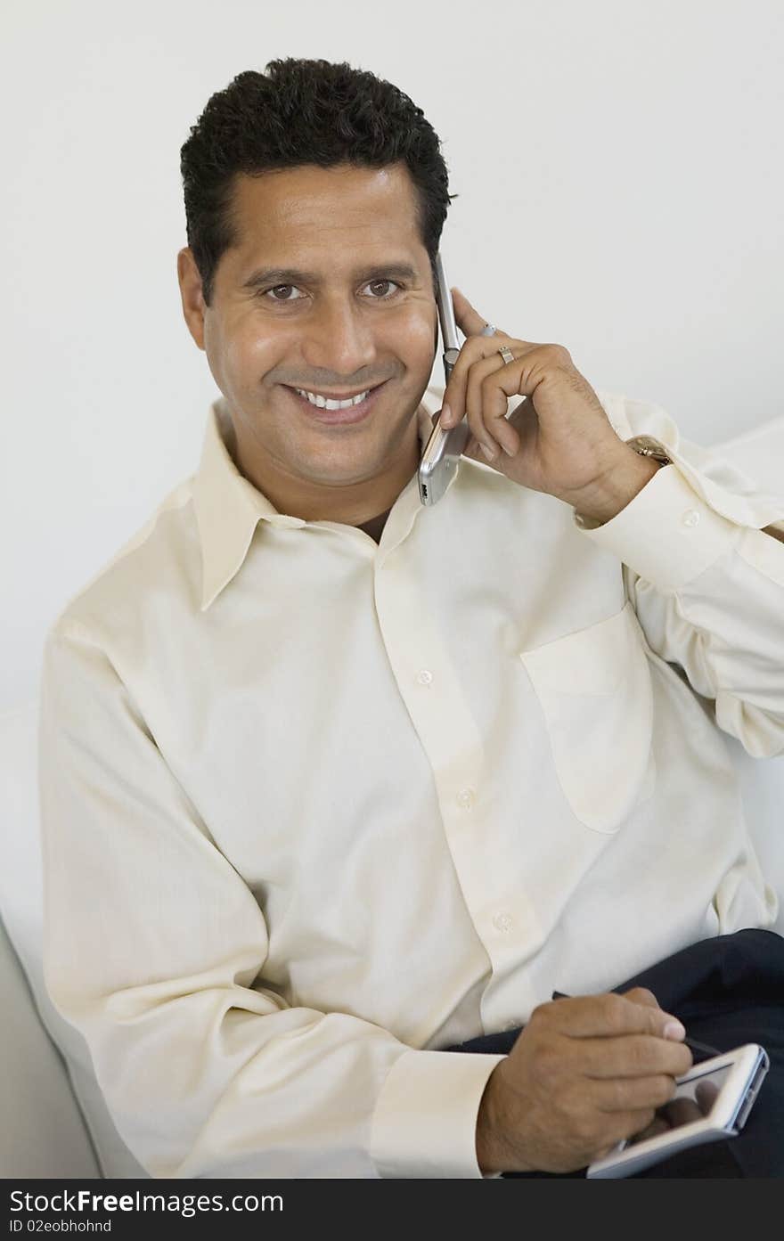 Businessman With PDA And Cell Phone