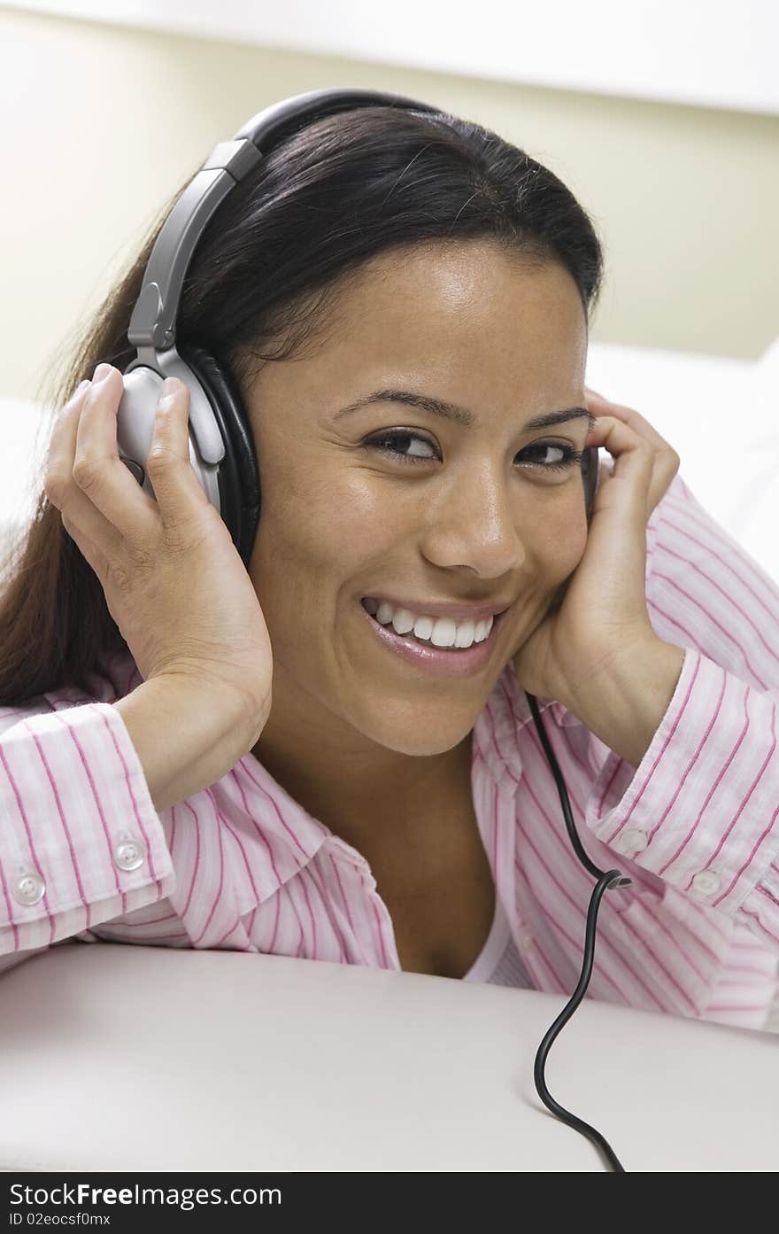 Woman lying on sofa Listening to Music