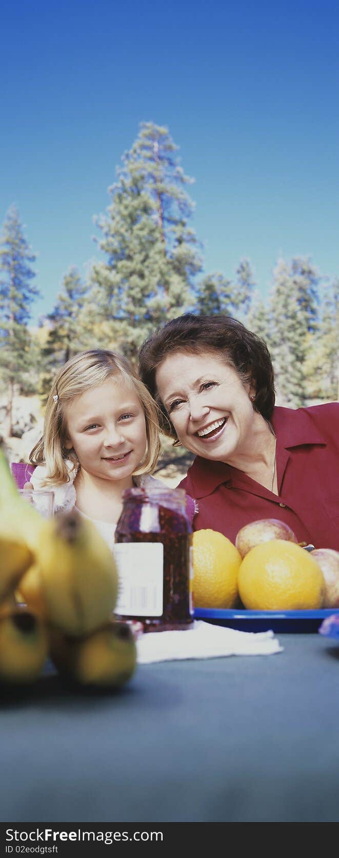 Grandmother and Granddaughter, forest in background