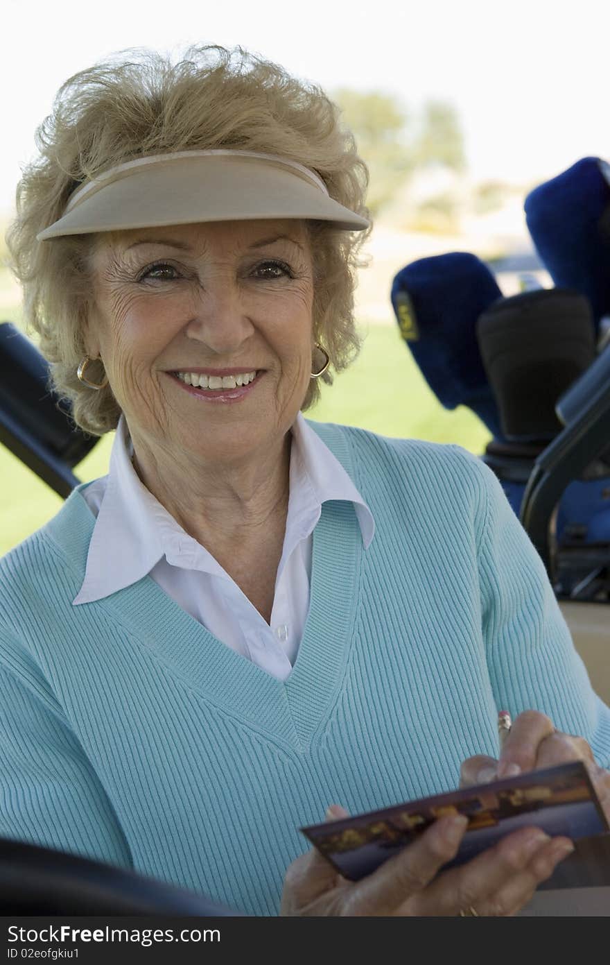 Senior Woman Holding Golf Score Card