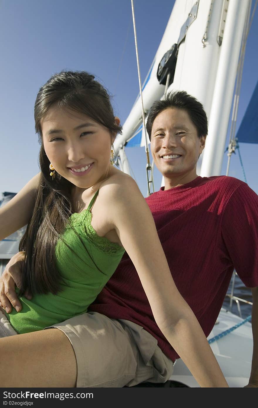 Couple Relaxing On Boat