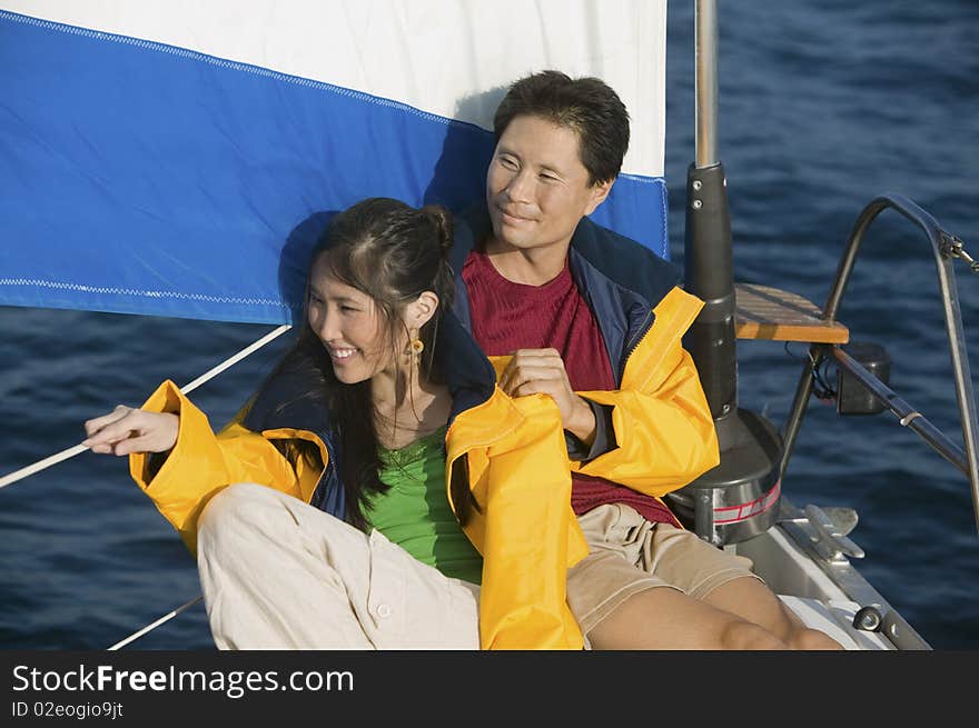 Couple Relaxing On Yacht