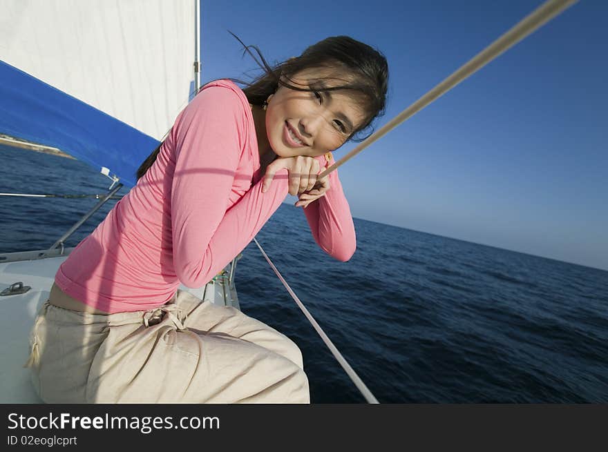 Woman Relaxing On Sailboat