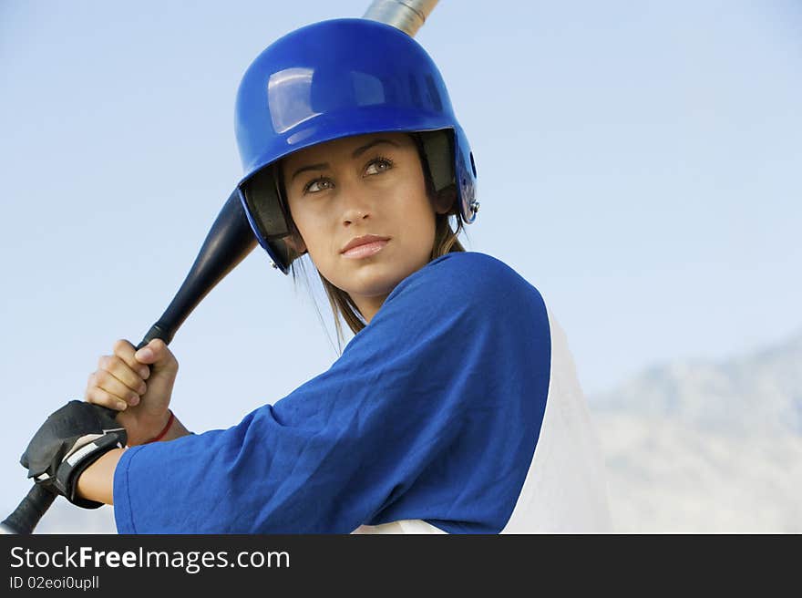 Young woman with softball bat