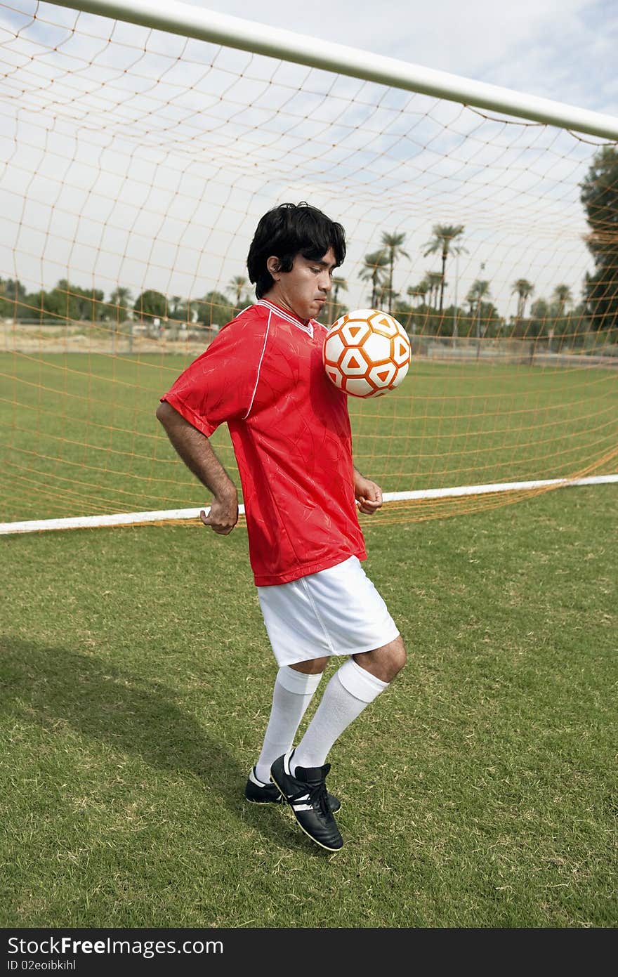 Soccer player juggling ball