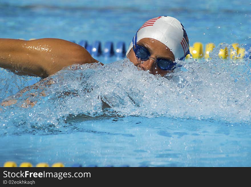 Young male swimming in outdoor pool. Young male swimming in outdoor pool