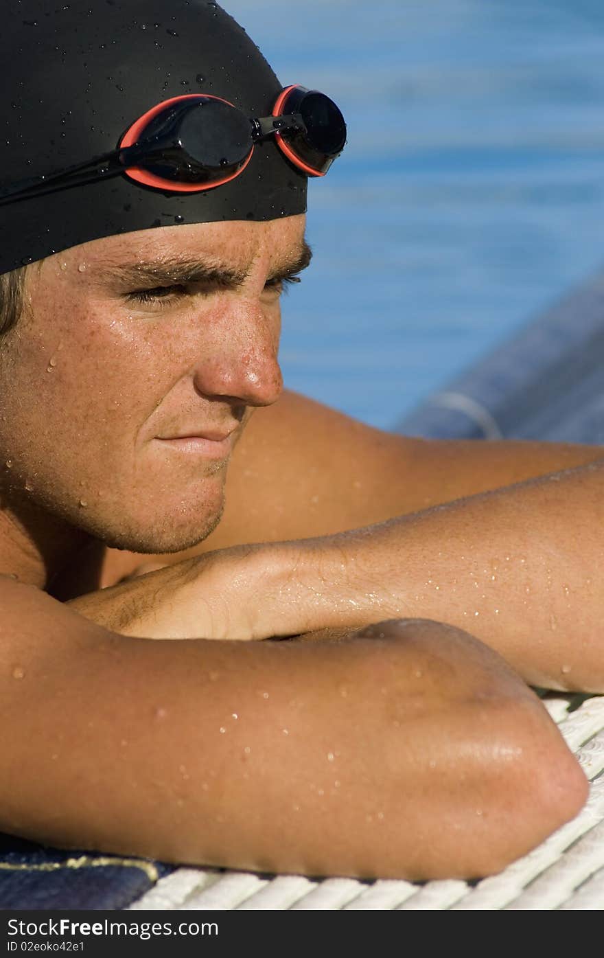 Swimmer at Pool Edge in contemplative mood