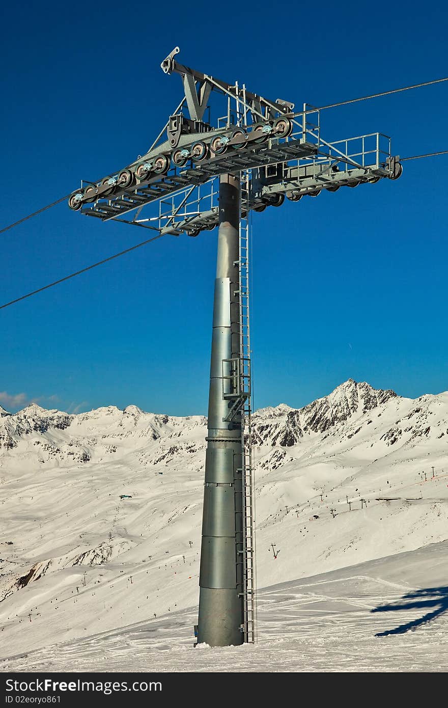 Ski lift pole with support rolls.