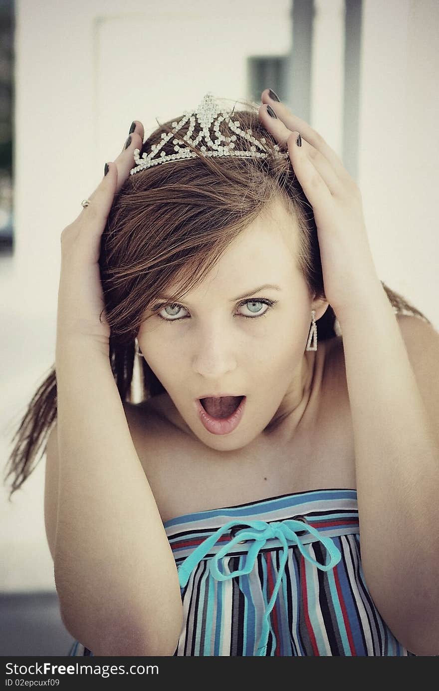 Girl with long brown hair in crown