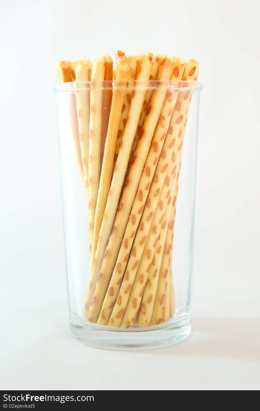 A famous asian snack called cracker sticks served in a cup.