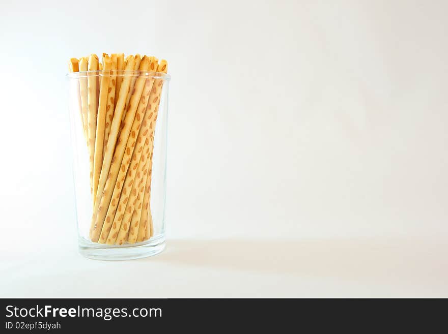 A famous asian snack called cracker sticks served in a cup.