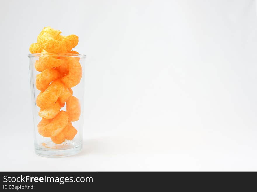 A famous cheese snack served in a transparent cup. A famous cheese snack served in a transparent cup.