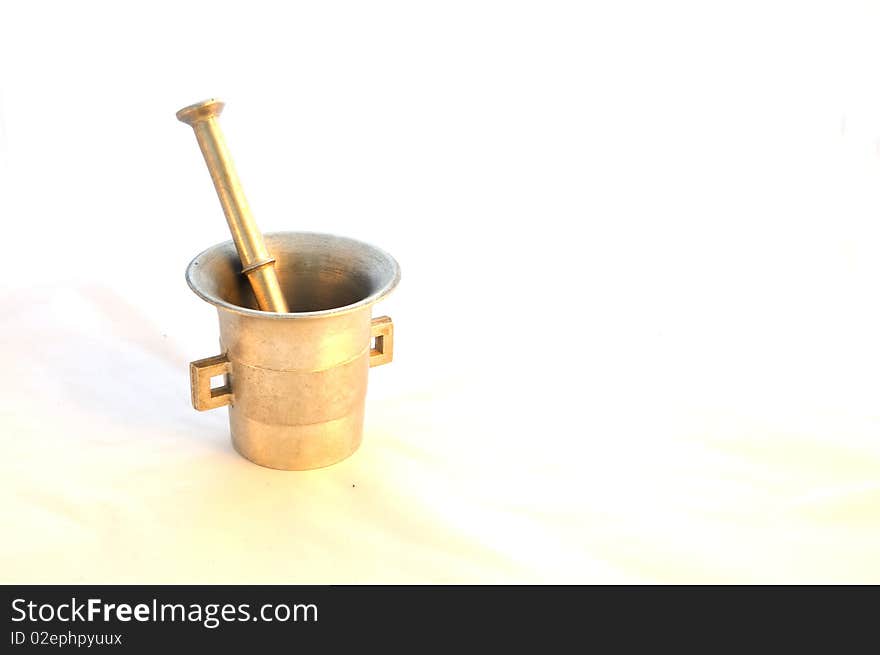 Isolated, old mortar like made of gold from grandmother. Isolated, old mortar like made of gold from grandmother.