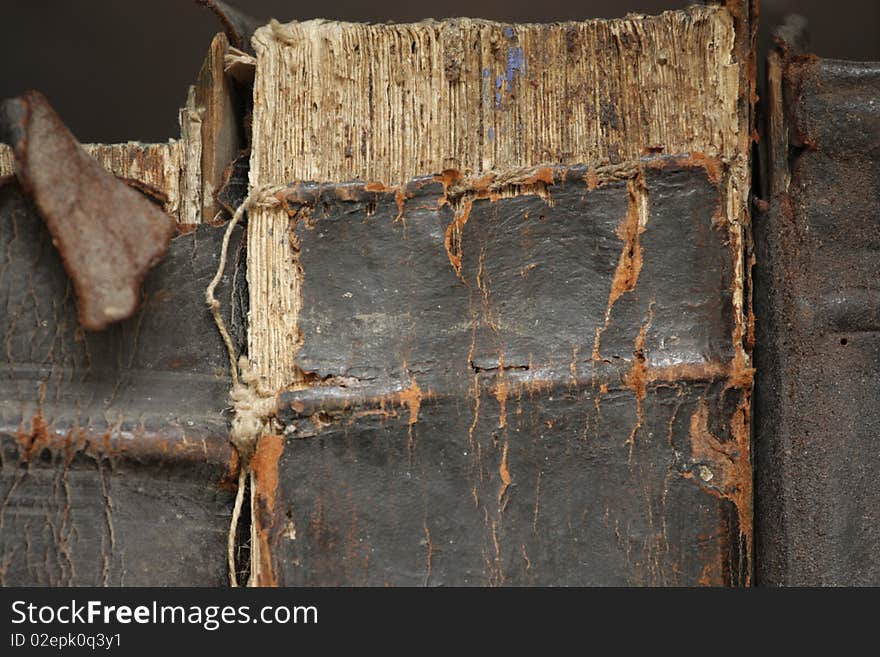 Three old books with tattered bindings