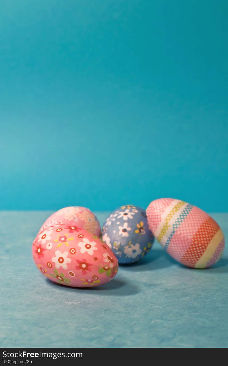 Decorated easter eggs on blue background/vertical