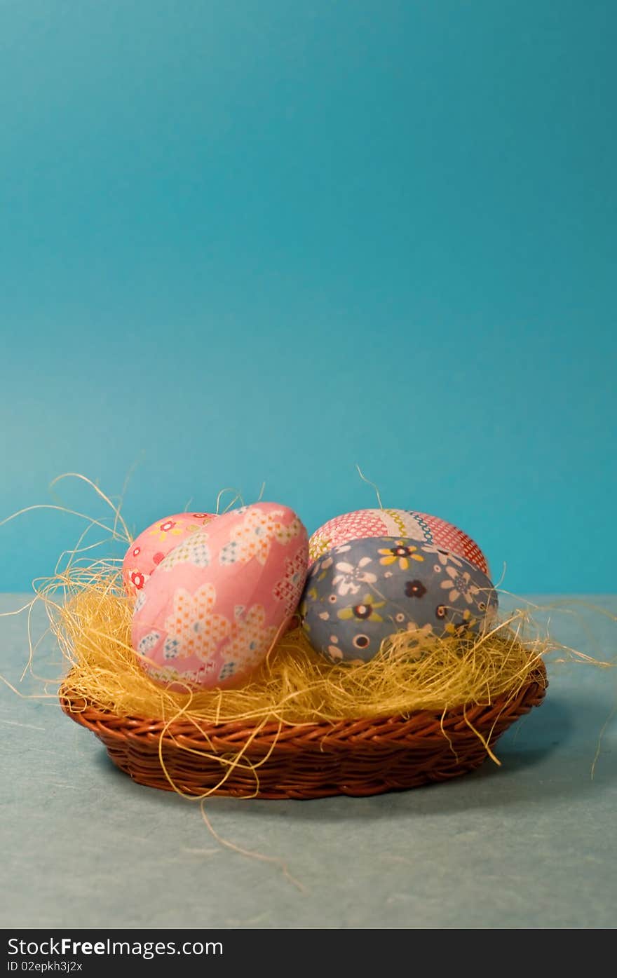 Decorated easter eggs on blue background/vertical