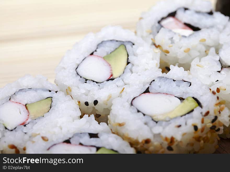 Tasteful Japanese sushi over bamboo background.