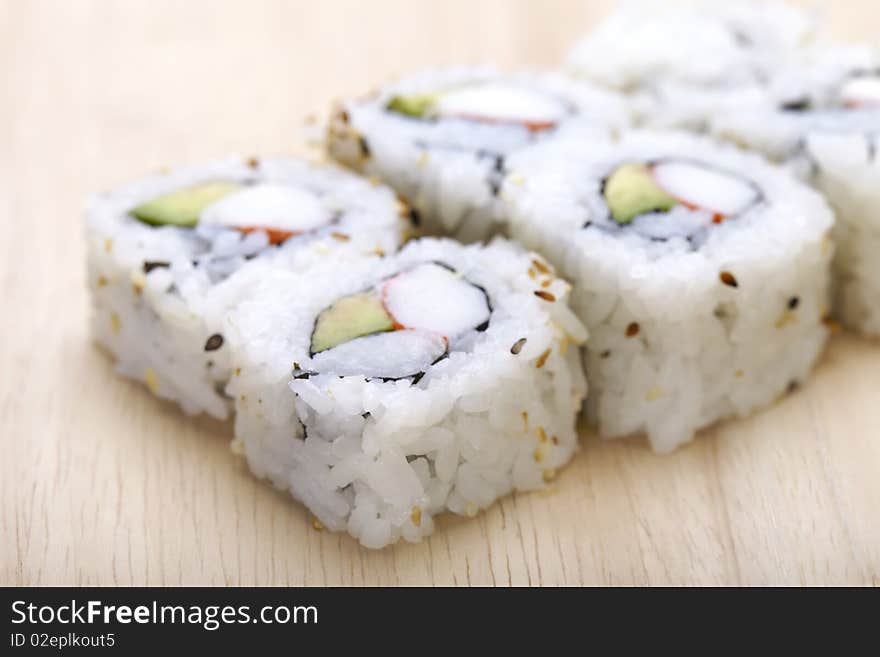 Tasteful Japanese sushi over bamboo background.