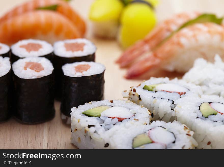 Tasteful Japanese sushi over bamboo background.