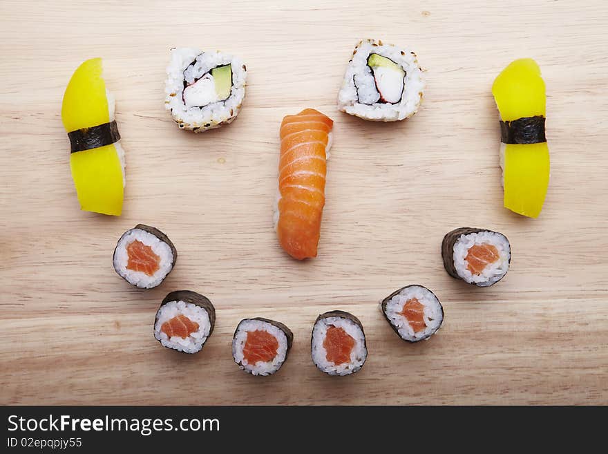 Tasteful Japanese sushi over bamboo background.