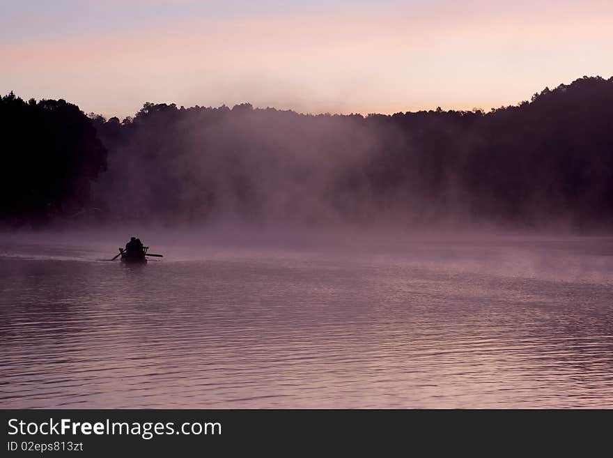 Kayak at sunrise with fog