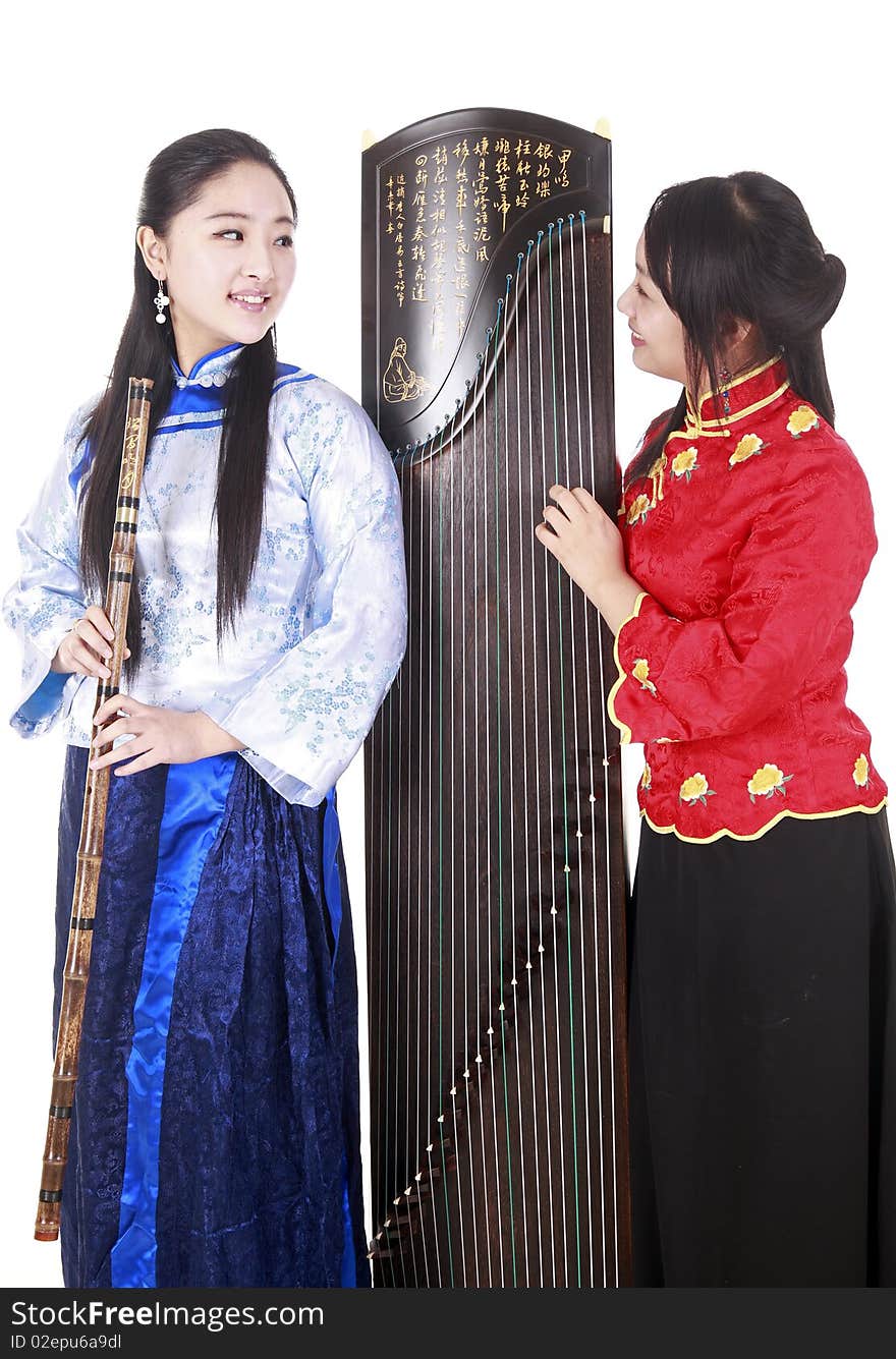 Two Chinese musicians with bamboo flute and zither talking on white.

Chinese characters on the flute means
wonderful voice,it is taken from one of China's ancient poetry.

Chinese character on zither is Chinese Tang poetry,also a famous Tang Dynasty poet's calligraphy. It praised the unique charm of the zither.