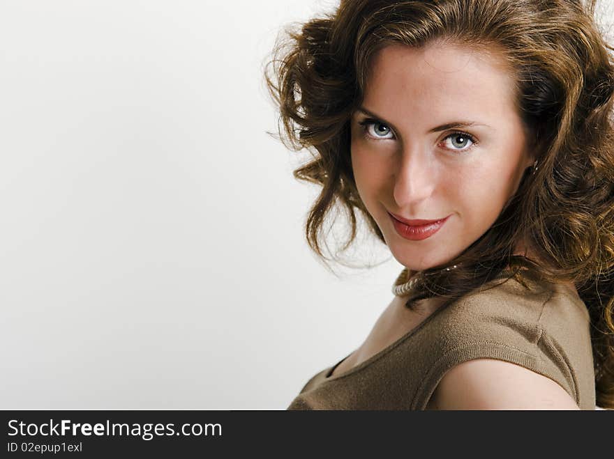 Close-up portrait of a young attractive woman that looking at camera