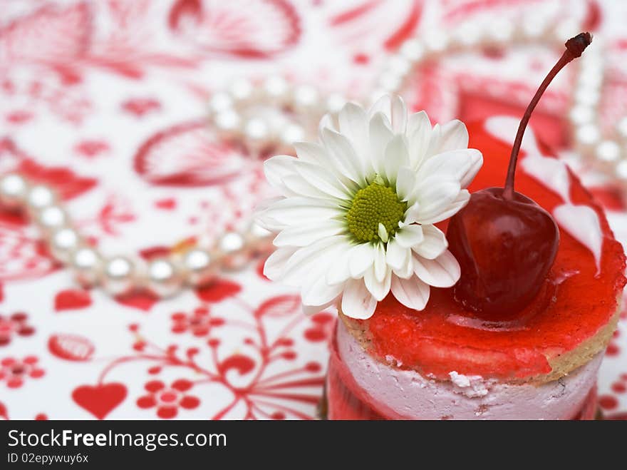 Shot-cut sweet fruit red cake with cherry  and white camomile. Shot-cut sweet fruit red cake with cherry  and white camomile