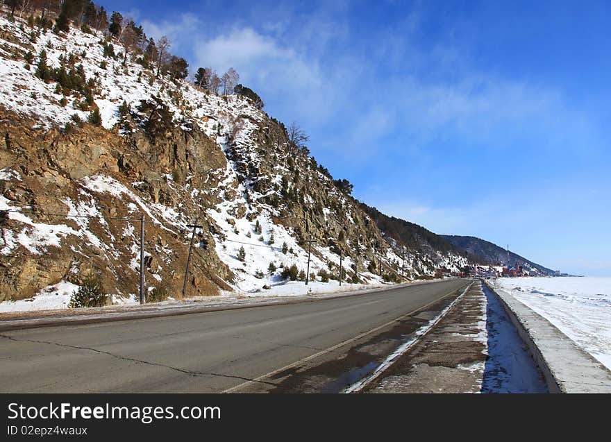 Part of road. Coast of the frozen Baikal Lake.