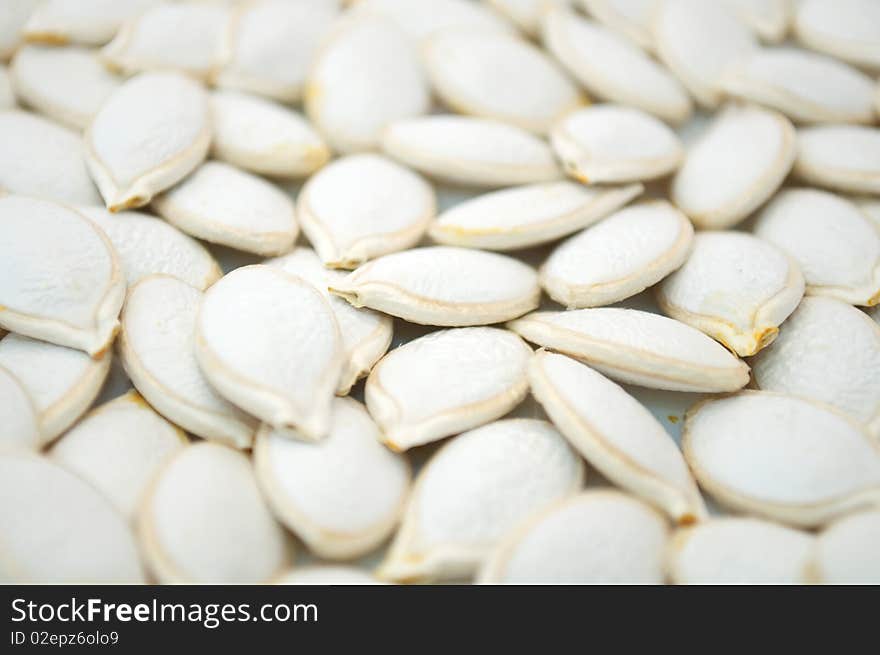 Unhulled pumpkin seeds (can be used as a background)