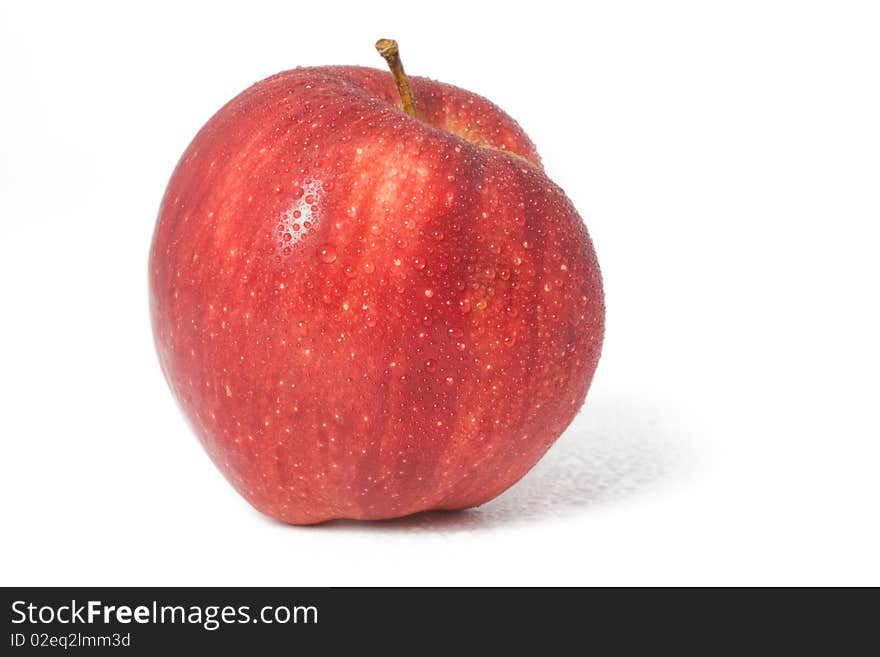 Fresh red apple with drops of water