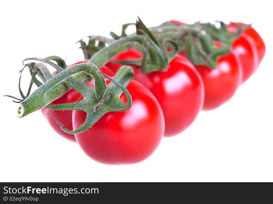 Fresh cherry tomatoes isolated on white background