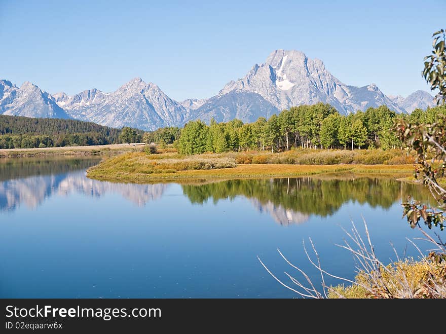 Grand Teton mountains and reflections on Snake River's Oxbow Bend. Grand Teton mountains and reflections on Snake River's Oxbow Bend