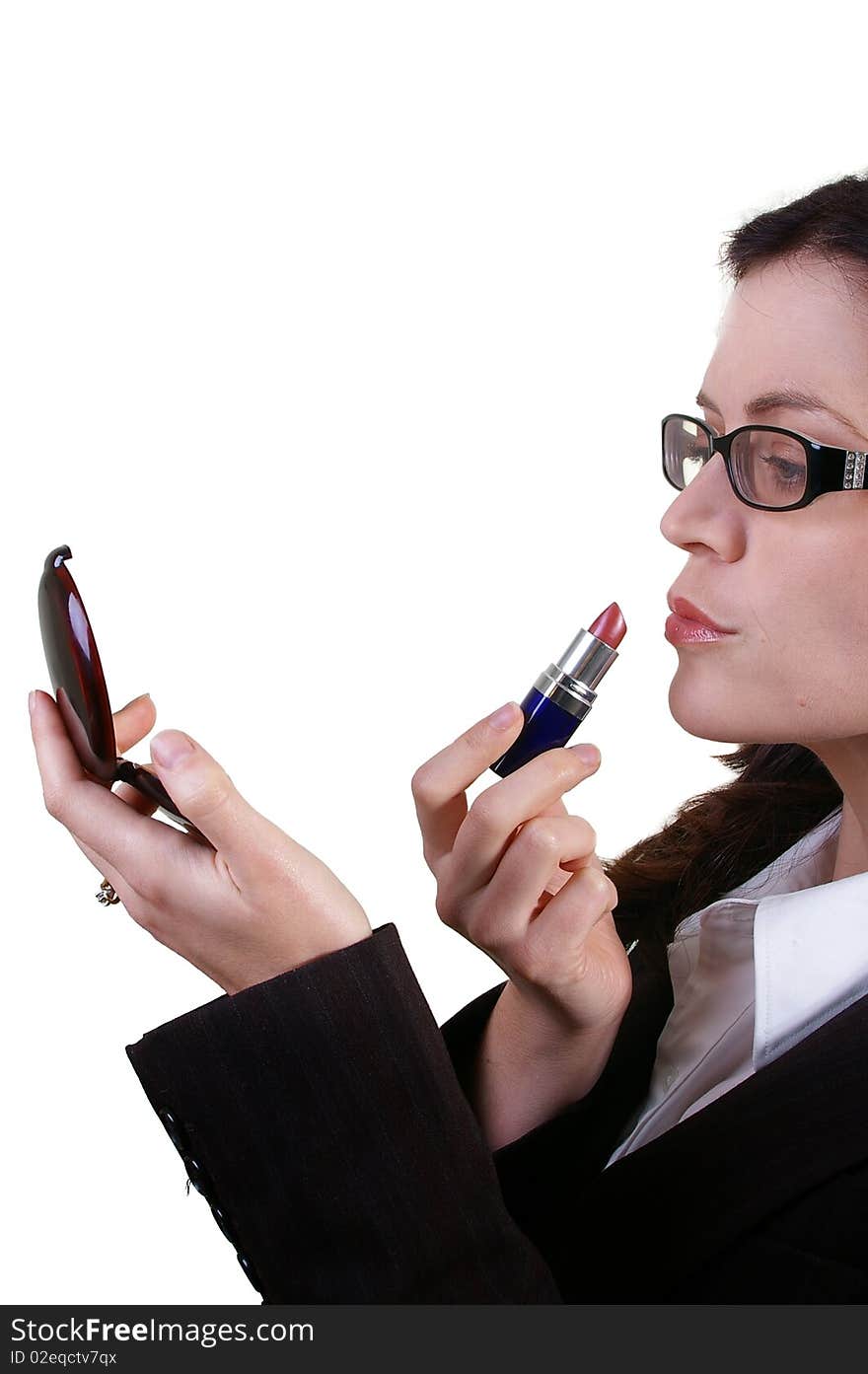 Business woman applying red lipstick with compact