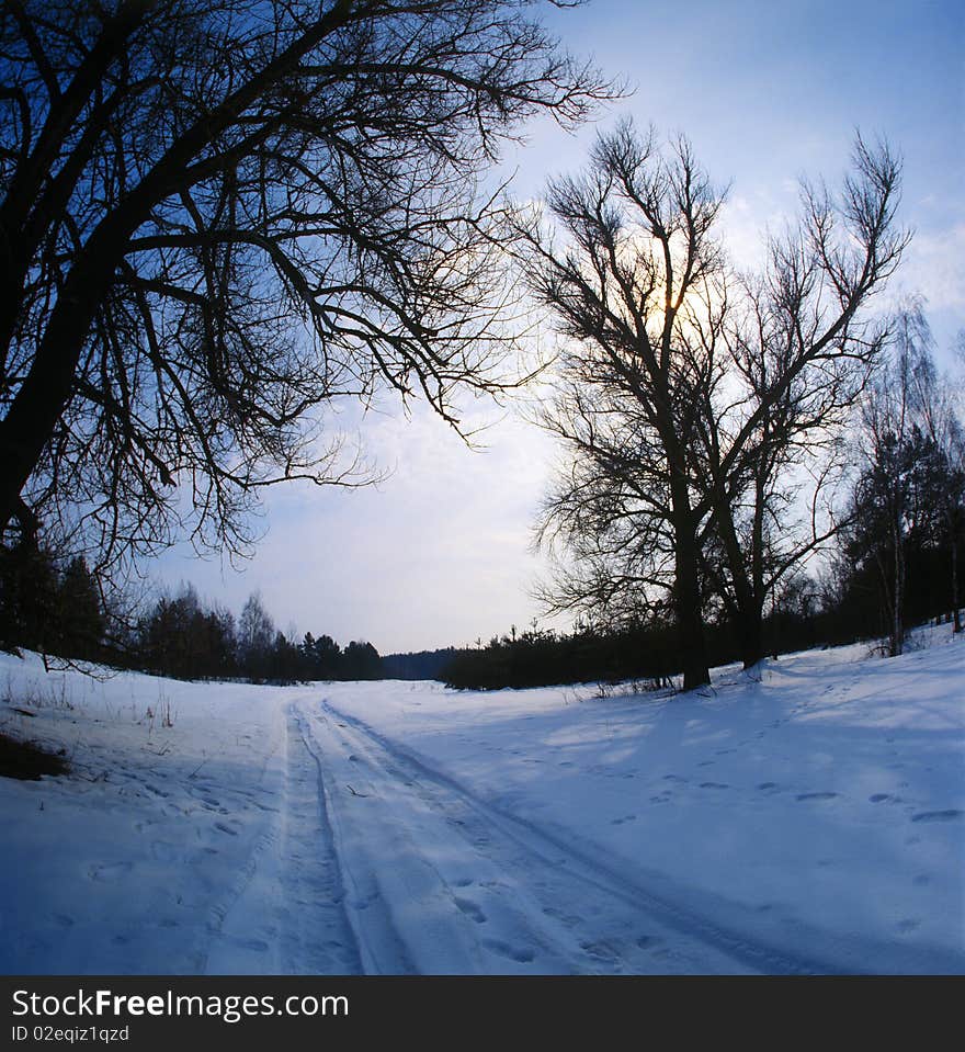 Winter road and blue sky. Winter road and blue sky.