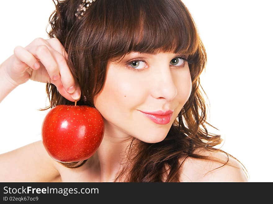 Portrait of lovely young girl holding a ripe red apple