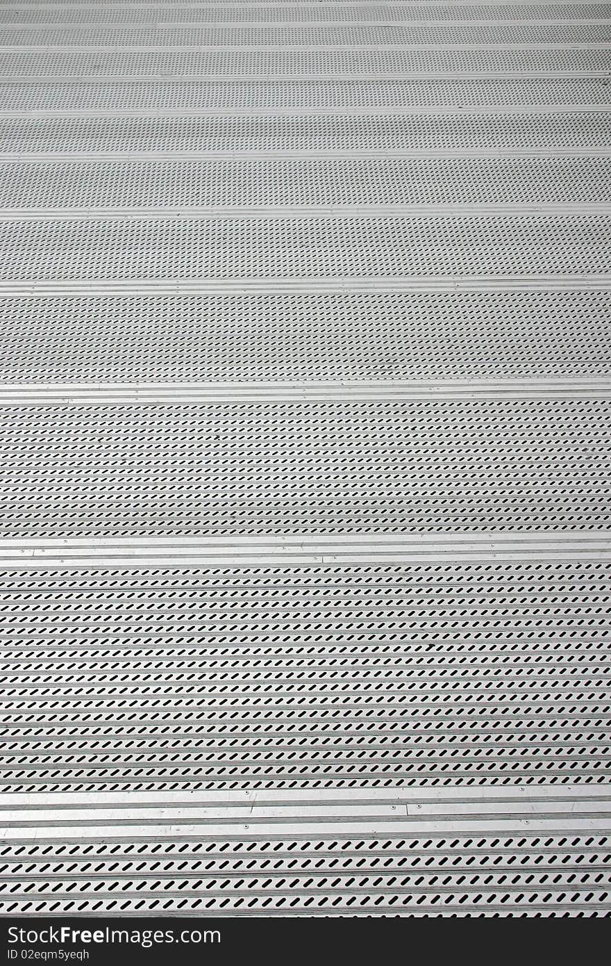 A flight of aluminum stairs shot from the top. A flight of aluminum stairs shot from the top