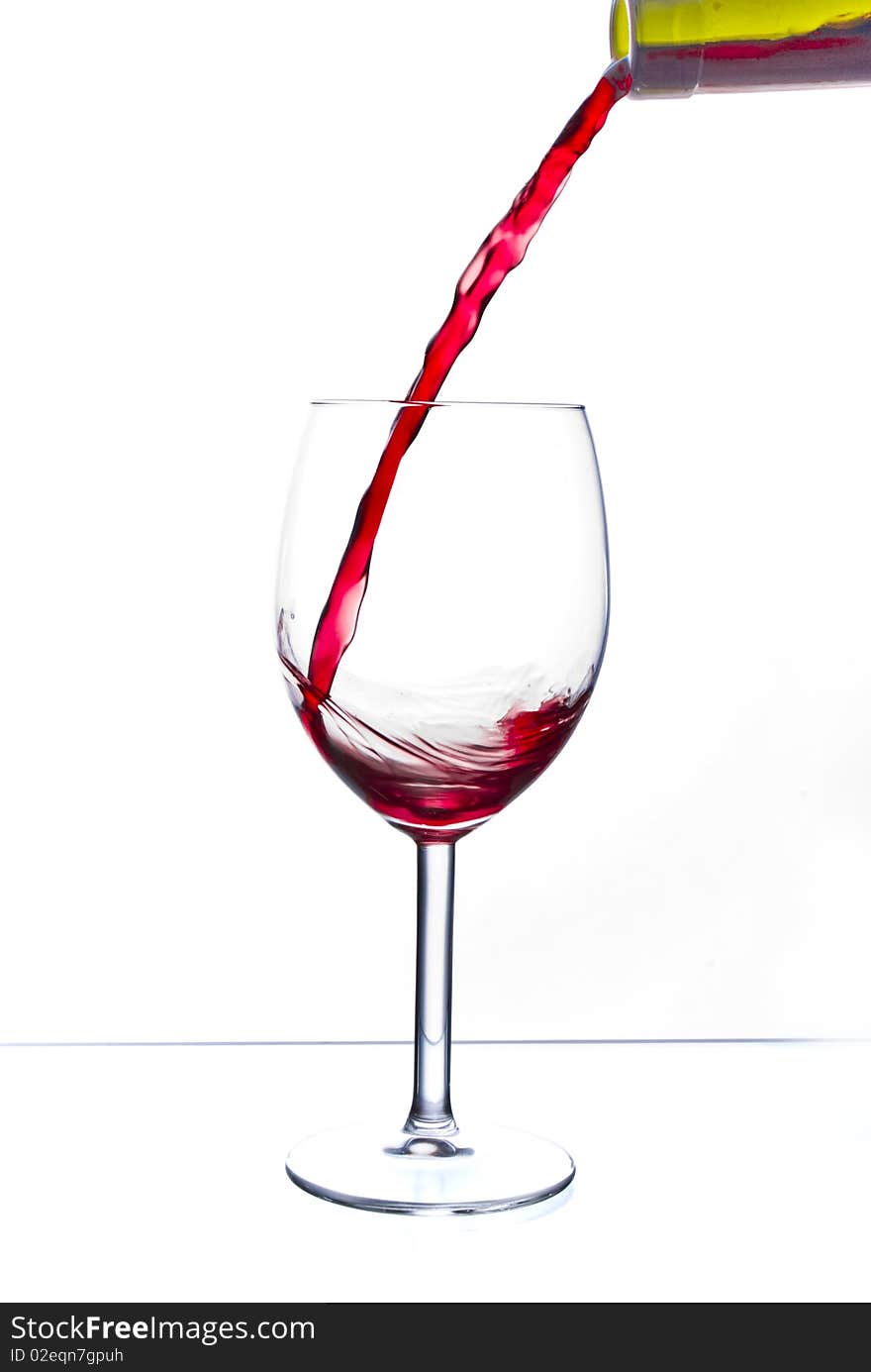 Red wine poured into glass