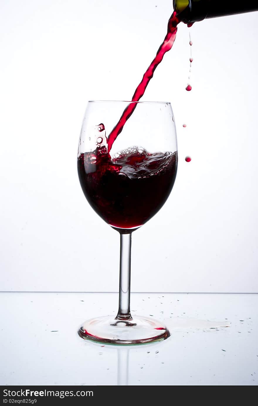 Red wine poured into glass