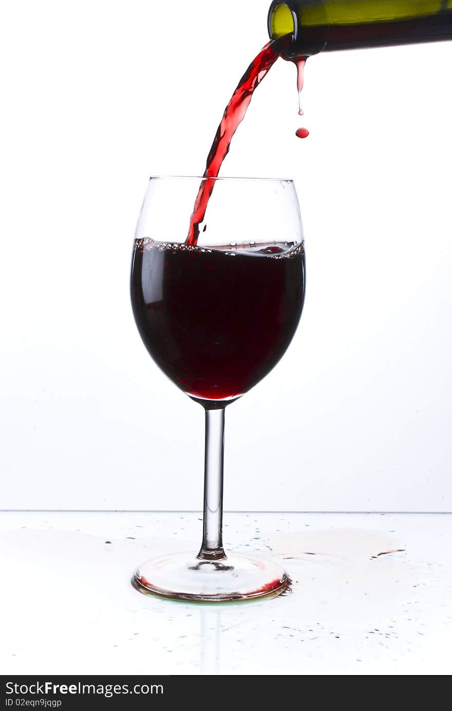 Red wine poured into glass