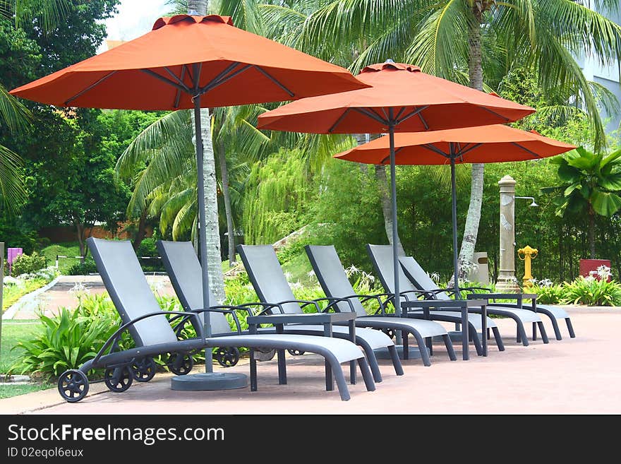 An image showing poolside deckchair for swimmer to relax