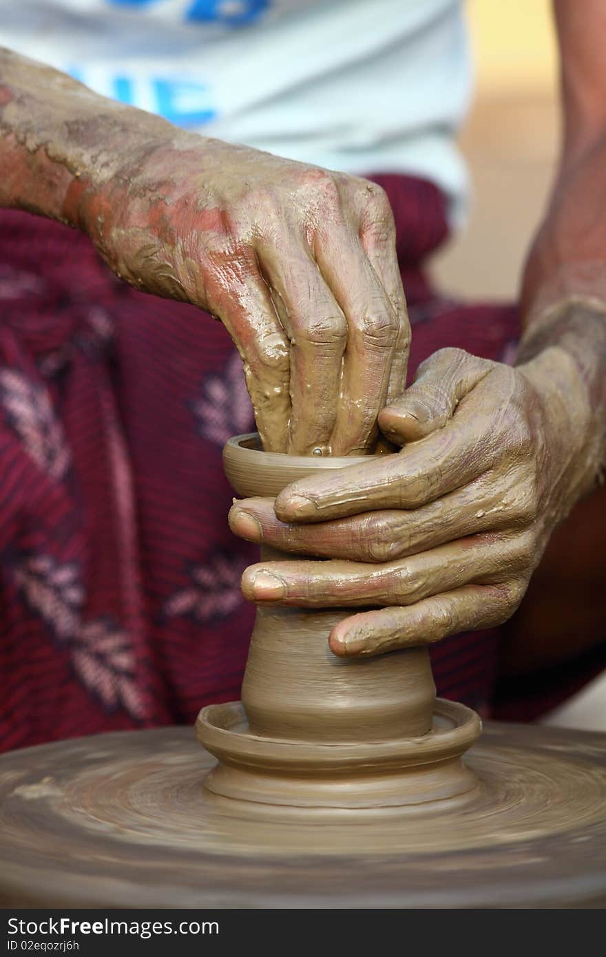 Indian potter makes a Lamp out of clay