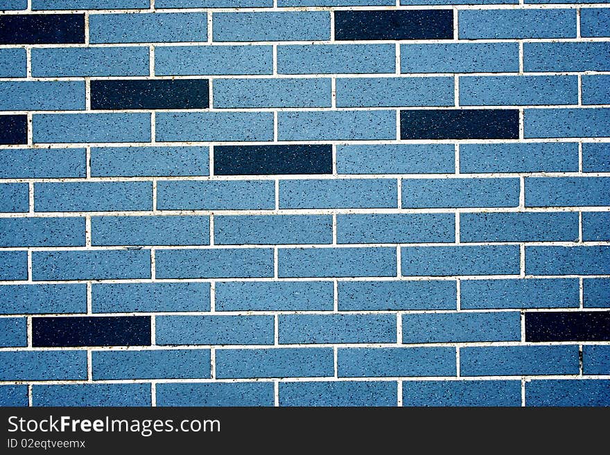 Blue and black brick wall