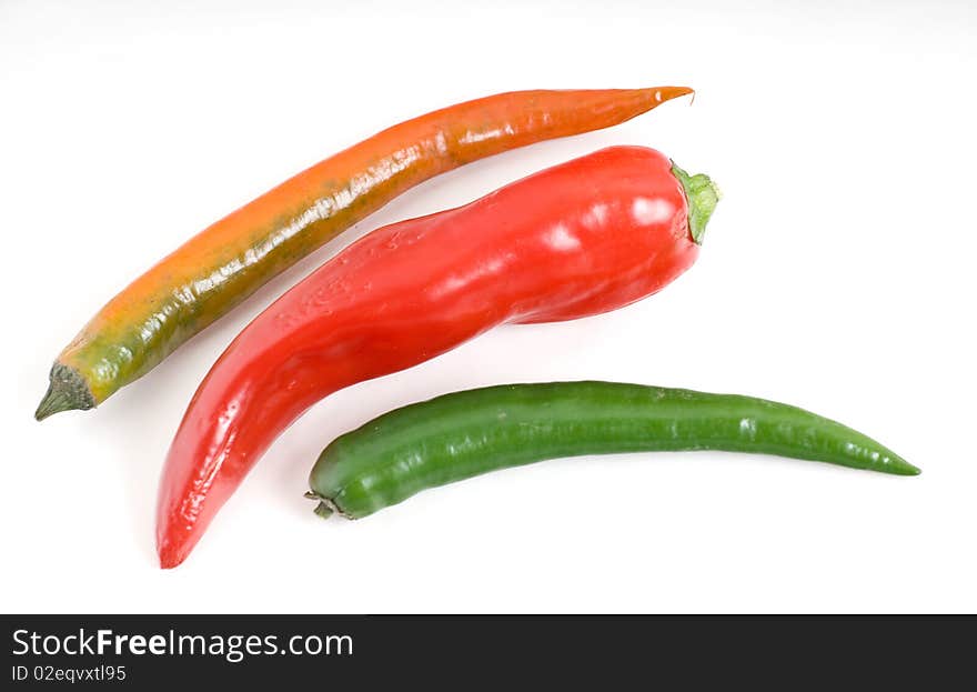 This is a sharp, bitter green chilli and red on a white background. This is a sharp, bitter green chilli and red on a white background