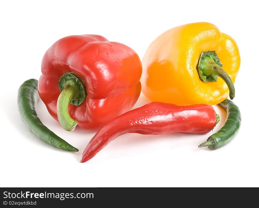 It is bitter and sweet peppers on a white background. It is bitter and sweet peppers on a white background