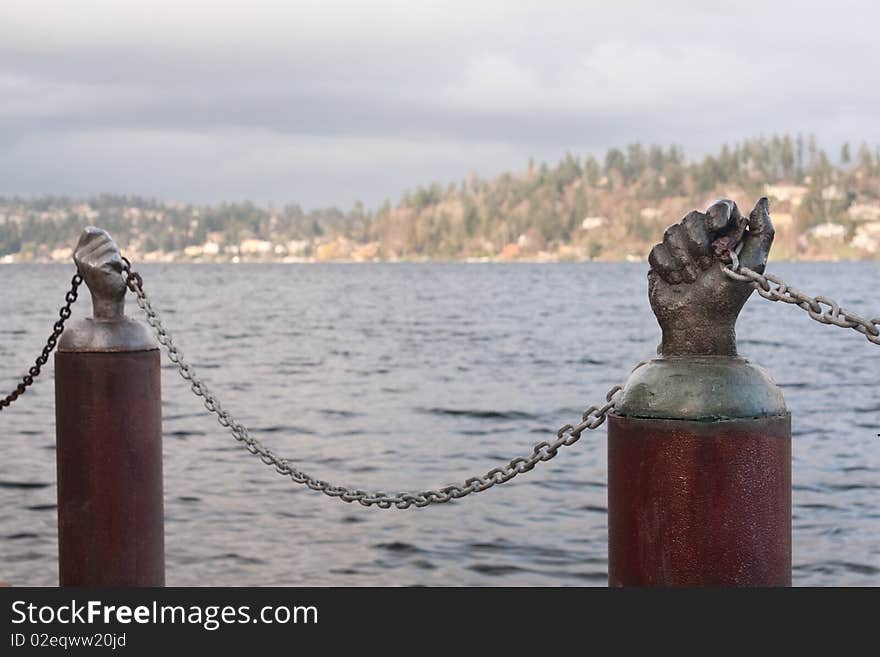 Chain Barrier with Hands at