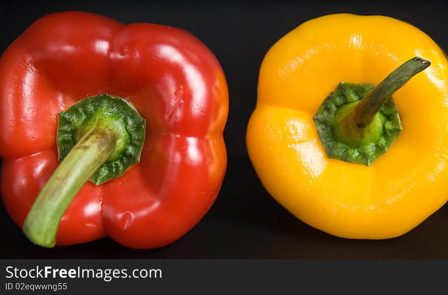 This is a big yellow and red peppers, sweet white background. This is a big yellow and red peppers, sweet white background