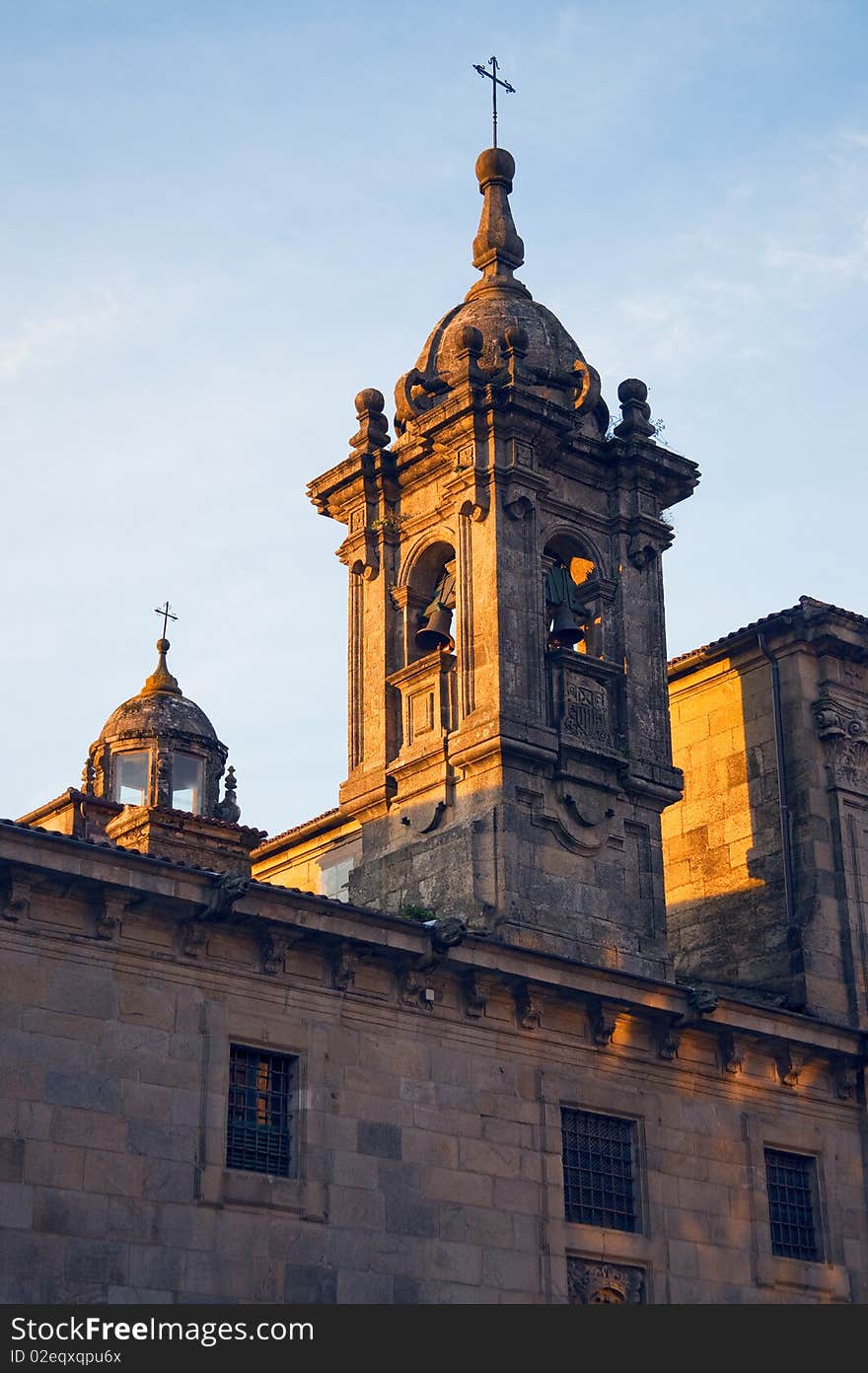 Chapel of the ancient church on the background of the morning sky in the sun rising in Santiago de Compostela Cathedral