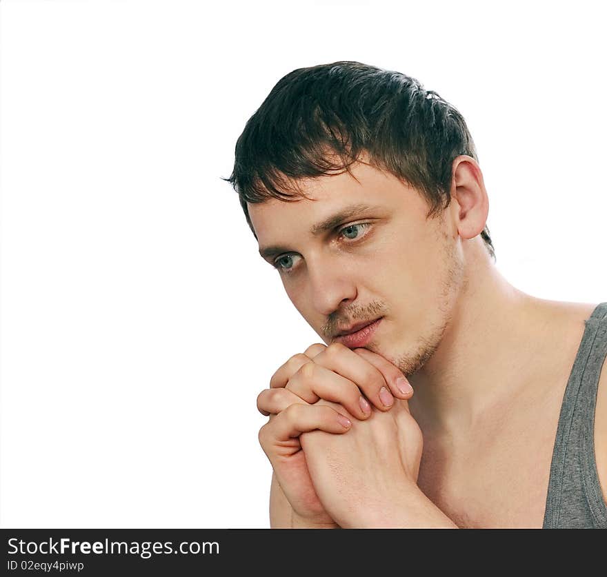 Thoughtful young man isolated on white